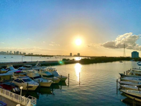 Modern waterfront apartment with pool and free parking 5 mins drive to Miami Beach